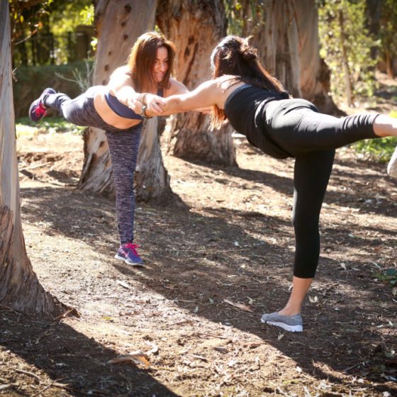 Partner workout: two women doing fitness