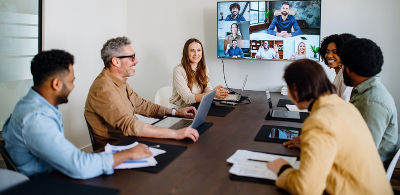 In-Office employees at hybrid workforce having a meeting