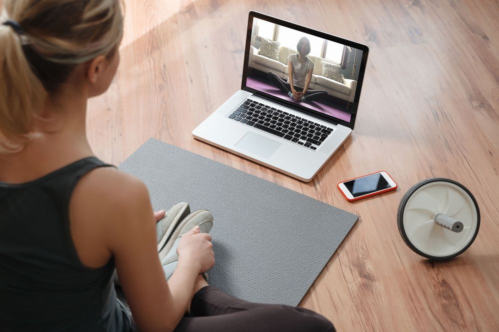 Beyond Caffeine, woman on floor doing yoga