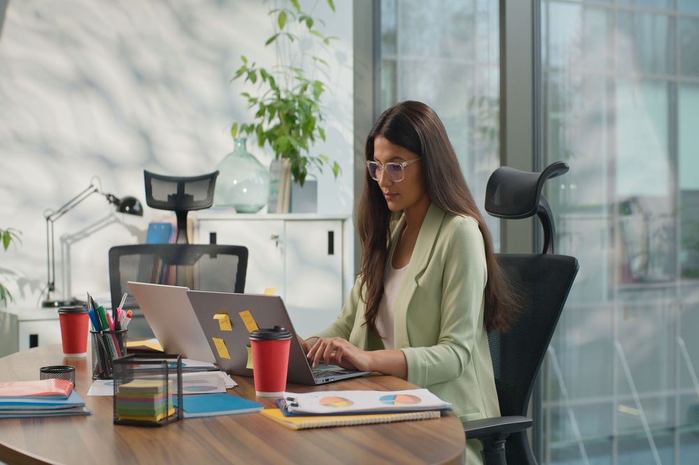 Financial blueprint, woman working at desk