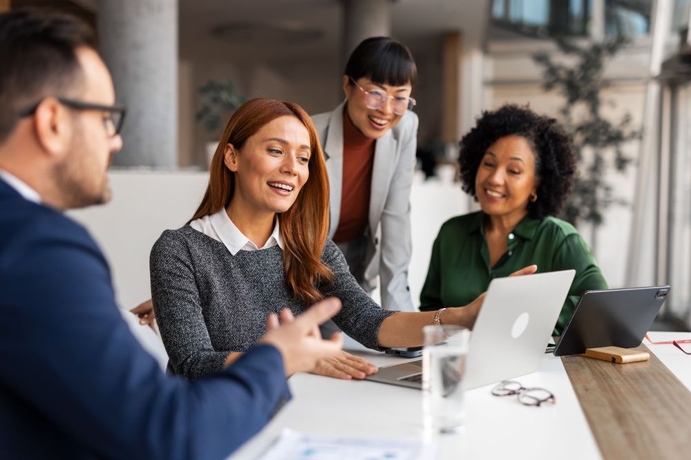 Coworkers working together at desk
