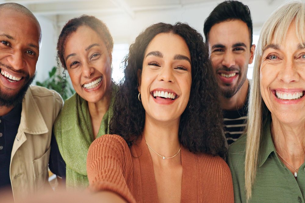Loyalty Factor, group of coworkers taking selfie smiling